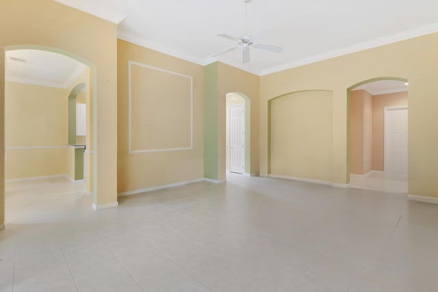 tiled spare room with ornamental molding and ceiling fan