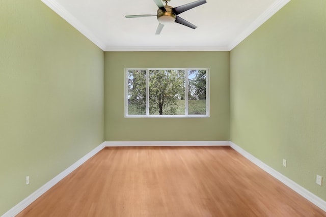 spare room featuring ceiling fan, ornamental molding, and light hardwood / wood-style flooring