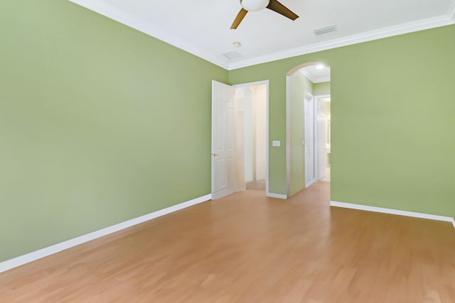 spare room featuring crown molding, ceiling fan, and light hardwood / wood-style flooring