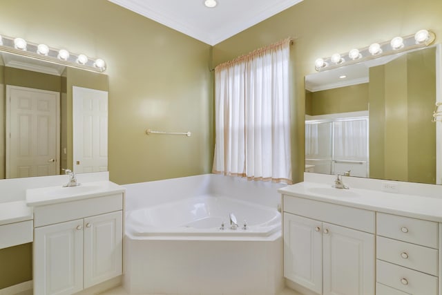 bathroom with vanity, tiled bath, and crown molding