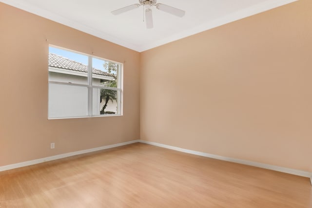 empty room with ceiling fan, ornamental molding, and light wood-type flooring