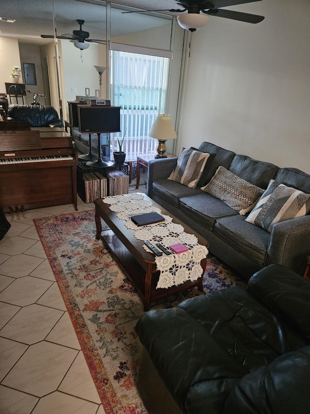 living room with tile patterned flooring and ceiling fan