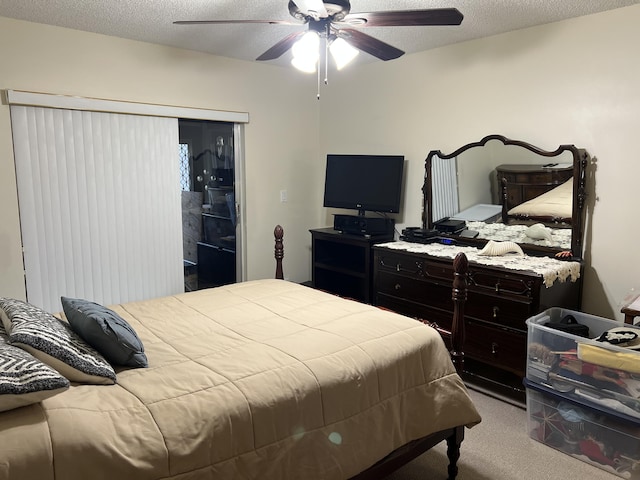 bedroom featuring light carpet, ceiling fan, and a textured ceiling