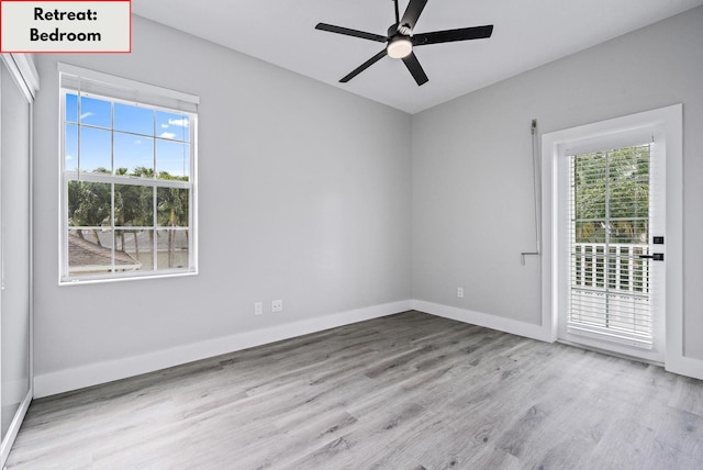 spare room featuring ceiling fan and light hardwood / wood-style flooring