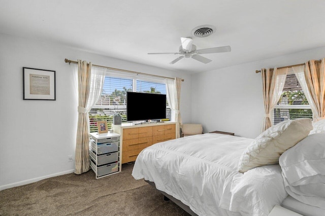 bedroom with multiple windows, carpet, visible vents, and baseboards