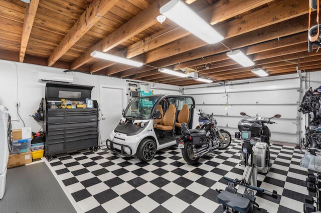 garage featuring a garage door opener and a wall mounted AC