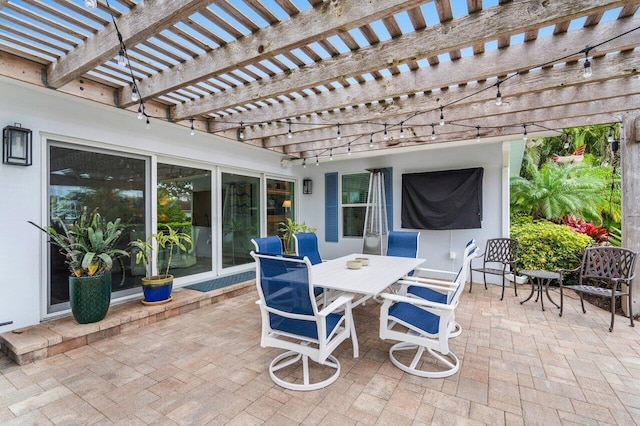 view of patio featuring outdoor dining area and a pergola