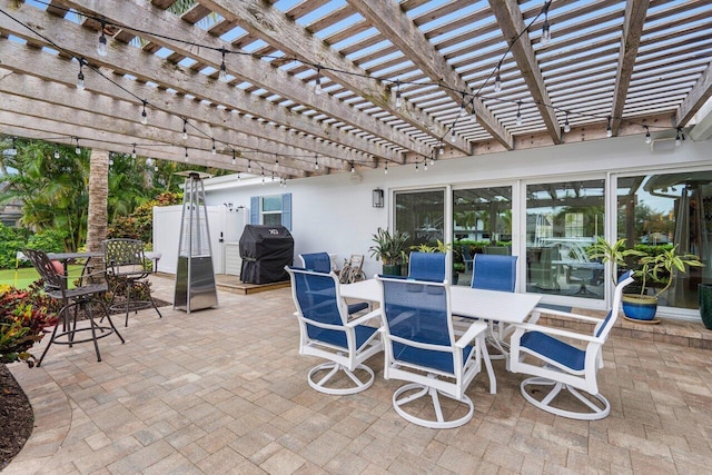 view of patio featuring outdoor dining space, area for grilling, and a pergola