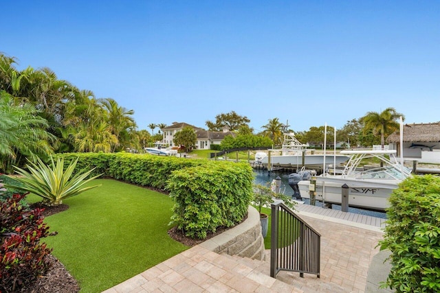 view of patio / terrace with a dock, a water view, and boat lift