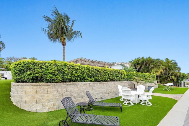 view of yard with fence and a pergola