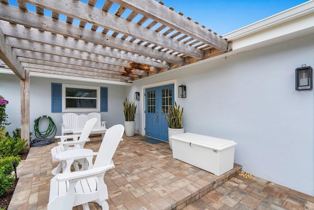 view of patio with french doors and a pergola