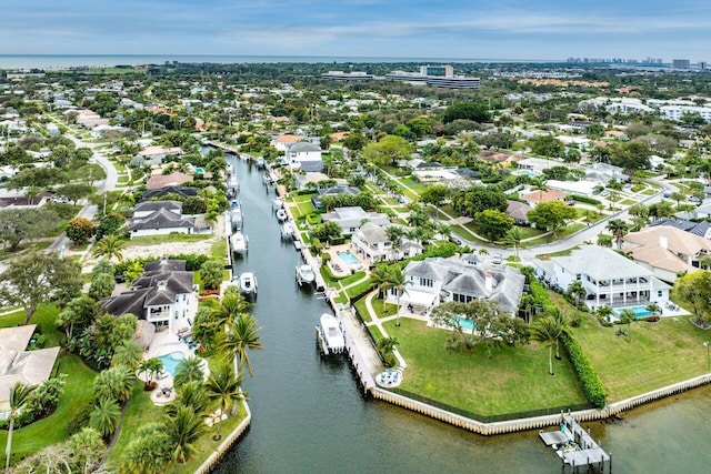 drone / aerial view featuring a water view and a residential view