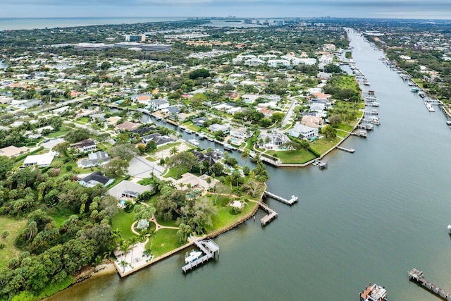 bird's eye view featuring a water view and a residential view