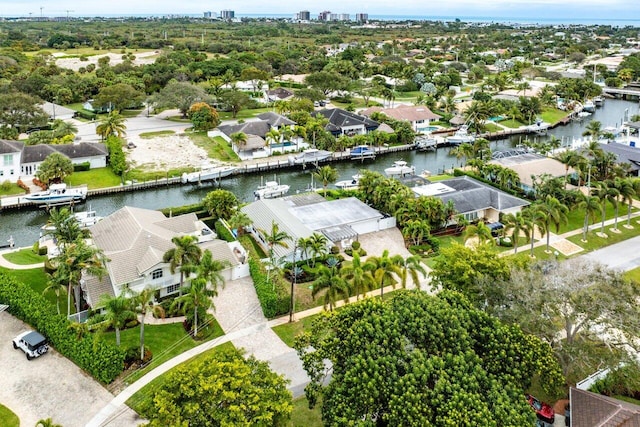 drone / aerial view with a water view and a residential view