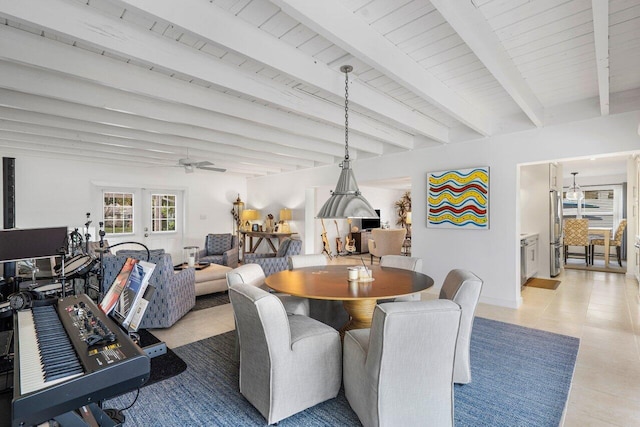 dining space featuring light tile patterned flooring and beamed ceiling