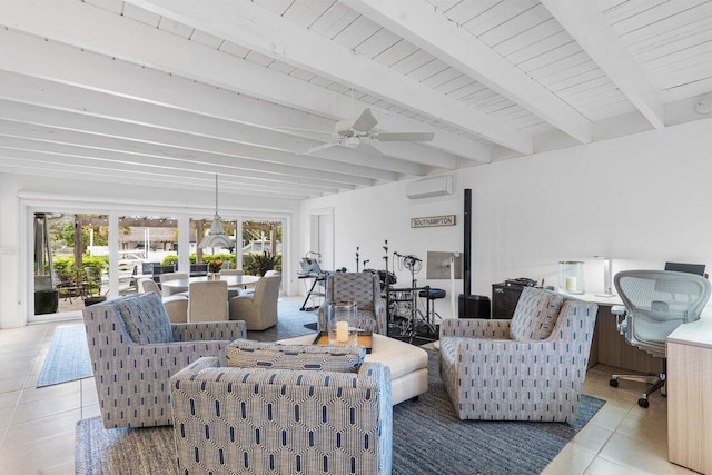 living room with light tile patterned floors, a wall mounted AC, beam ceiling, and a healthy amount of sunlight