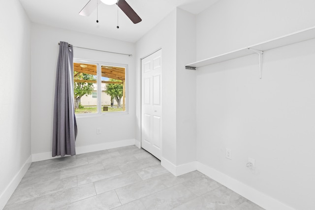 interior space featuring ceiling fan