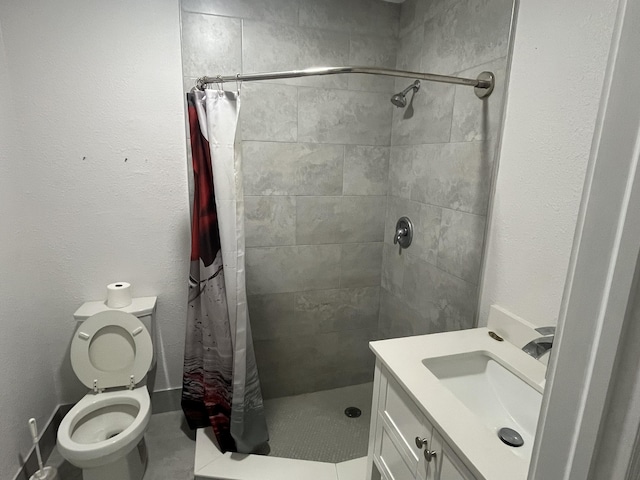 bathroom with toilet, tile patterned flooring, walk in shower, and vanity