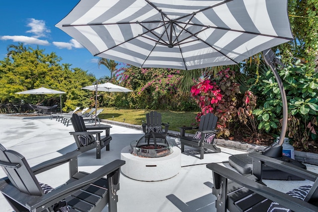 view of patio / terrace featuring a fire pit