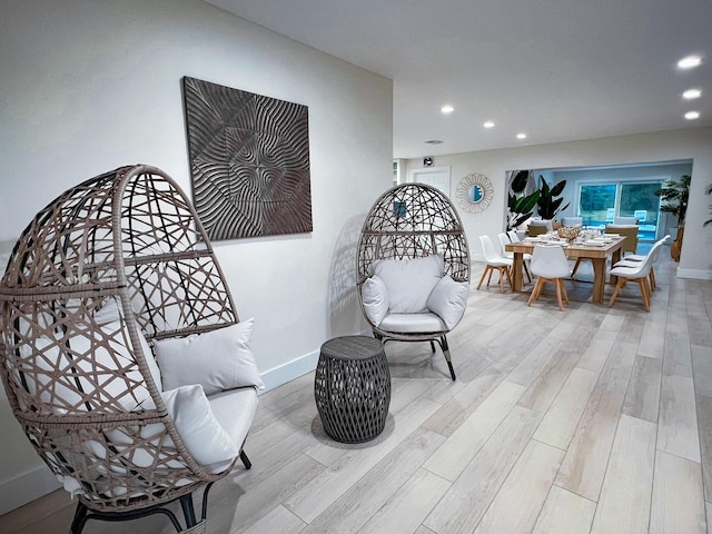 sitting room featuring light hardwood / wood-style flooring