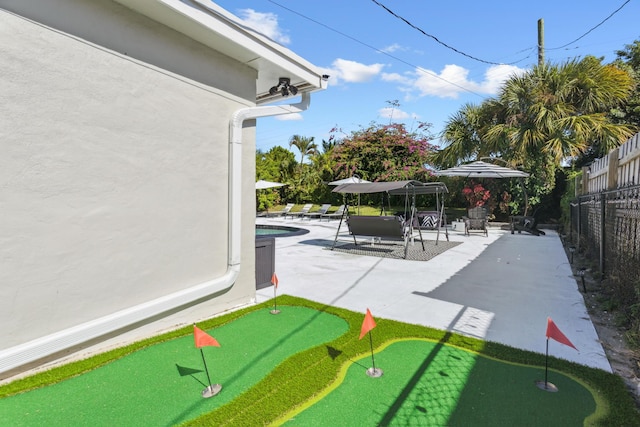 exterior space featuring a swimming pool and a patio