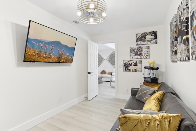 sitting room with light hardwood / wood-style flooring