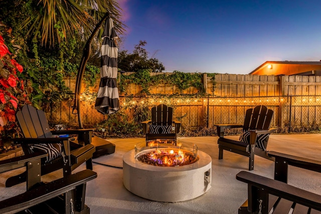 patio terrace at dusk with an outdoor fire pit