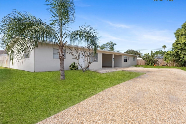 rear view of property with a lawn