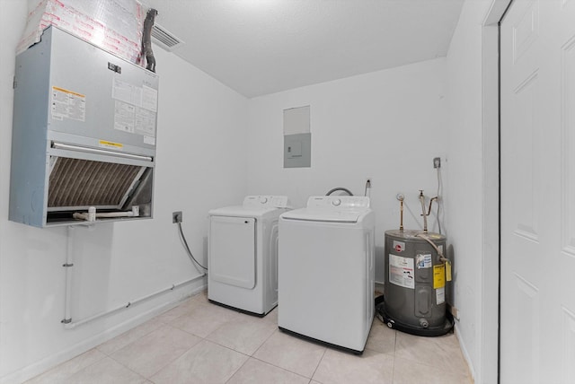 laundry area with separate washer and dryer, a textured ceiling, light tile patterned floors, and water heater