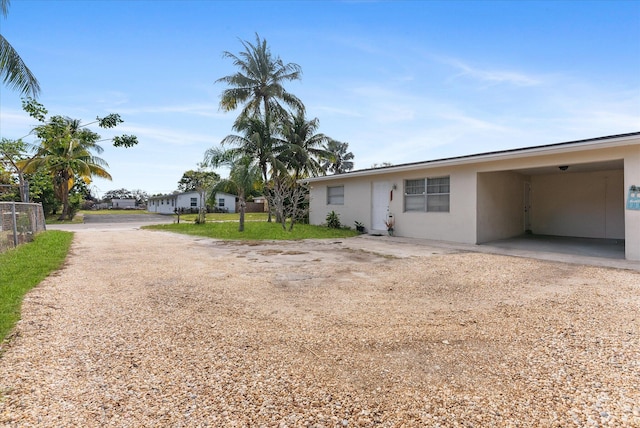 view of front of property with a carport