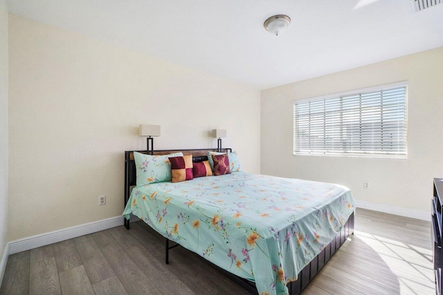 bedroom featuring hardwood / wood-style flooring