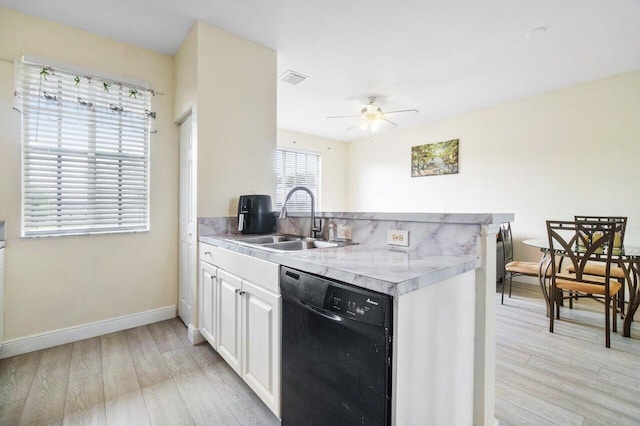 kitchen with sink, light hardwood / wood-style flooring, black dishwasher, ceiling fan, and white cabinets