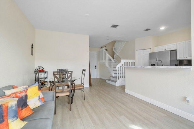 living room with light hardwood / wood-style floors