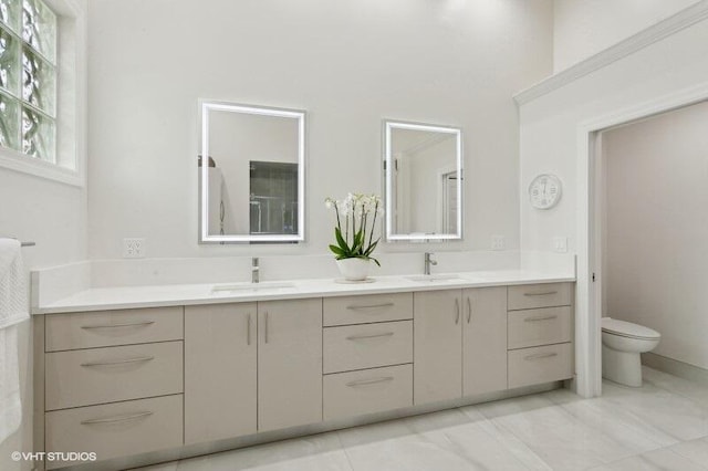 bathroom featuring vanity and toilet