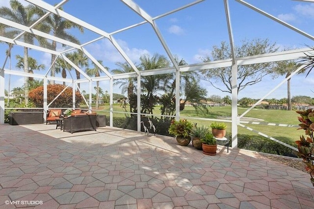 view of patio / terrace with an outdoor living space and a lanai