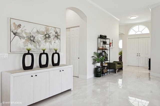 entrance foyer featuring crown molding