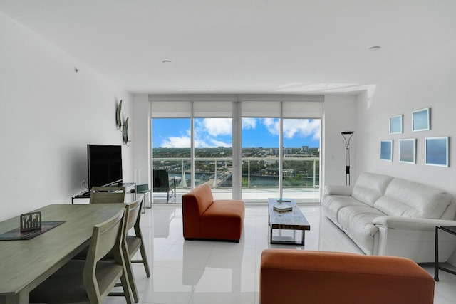 tiled living room with floor to ceiling windows