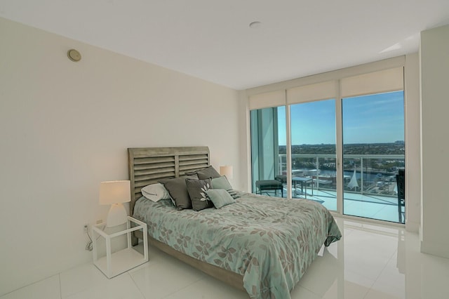 bedroom featuring floor to ceiling windows and access to outside