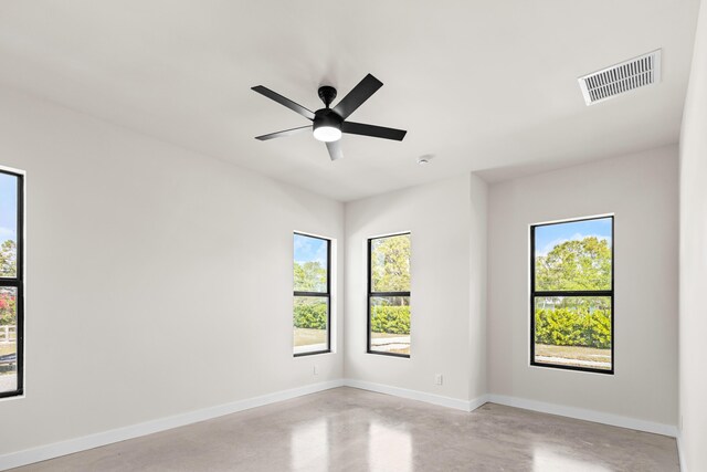 empty room with concrete flooring