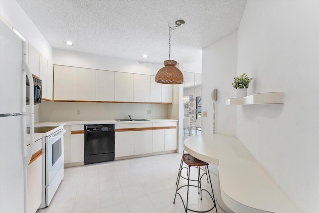 kitchen featuring sink, hanging light fixtures, black appliances, a textured ceiling, and white cabinets