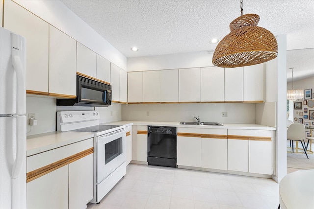 kitchen featuring sink, hanging light fixtures, black appliances, a textured ceiling, and white cabinets