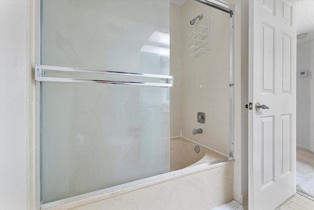 bathroom featuring tiled shower / bath