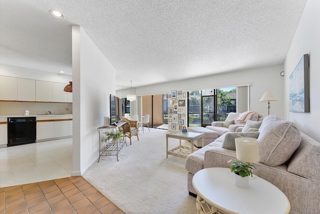 living room featuring a textured ceiling and light tile patterned floors