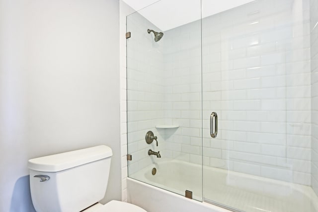 bathroom with bathtub / shower combination and toilet