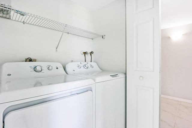 washroom featuring washer and clothes dryer