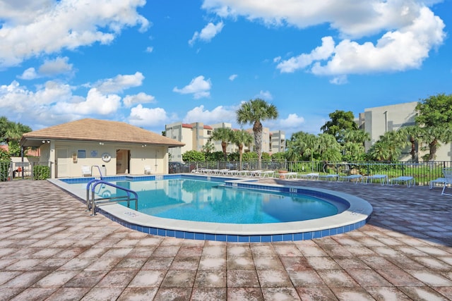 view of swimming pool featuring a patio area