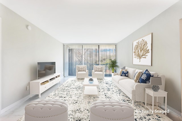 living room featuring floor to ceiling windows