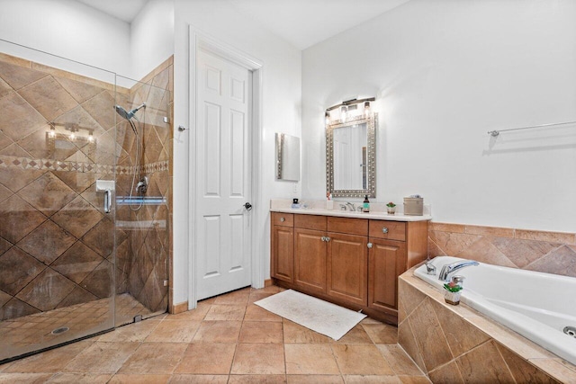 bathroom featuring shower with separate bathtub and vanity