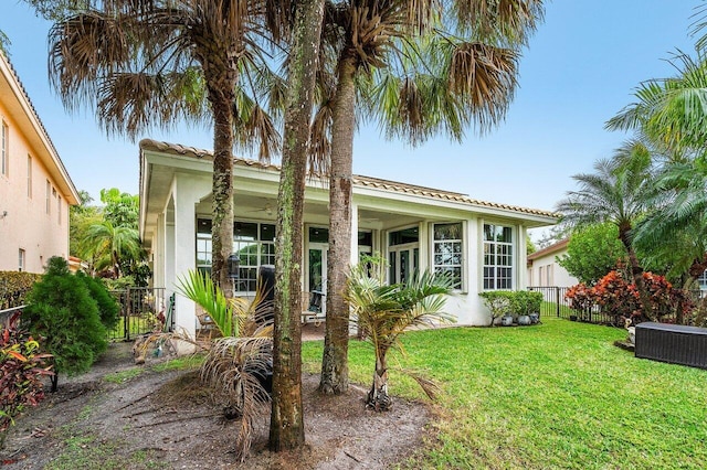 mediterranean / spanish-style house featuring a front yard