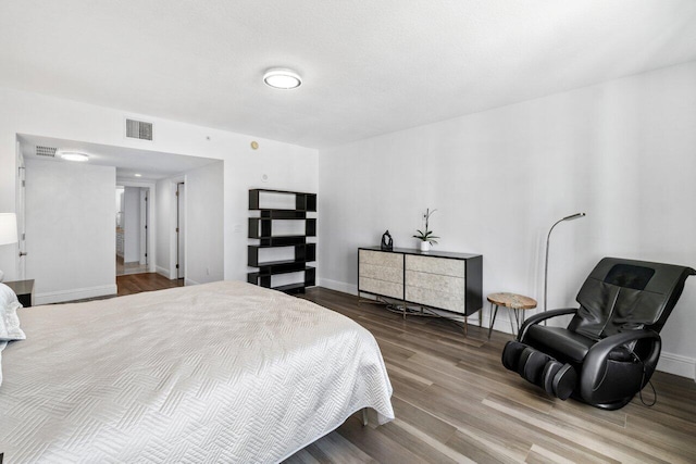 bedroom featuring hardwood / wood-style flooring